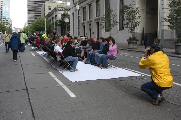 In Summer 2007, several hundred Seattle residents got downtown at 6am on a Sunday morning to participate in a city-sponsored photo shoot to demonstrate how much space different modes of public transport cost (e.g. bikes, cars, light rail and buses). This was coordinated by I-Sustain.
