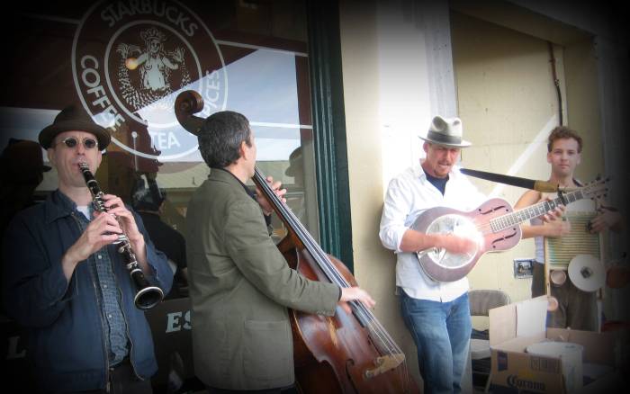 Seattle has a great selection of street performers & musicians; some of the very best that perform at Pikes Place. Here, a bluegrass band entertains just outside another landmark, the original Starbucks.