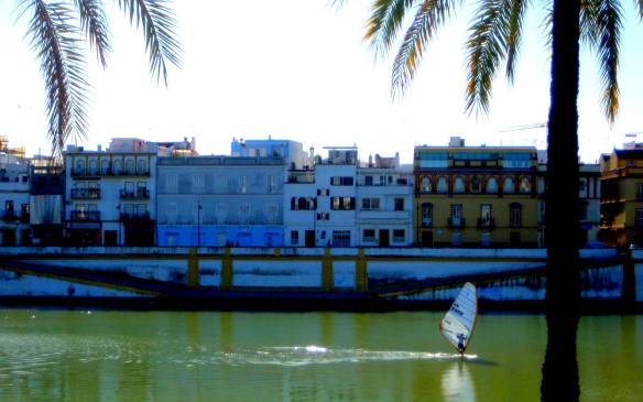 Enjoying Guadalquivir river... Where Spanish ships once sailed, returning from the New World, local residents now enjoy for windsurfing, or cycling. (There is an excellent cycling and walk way streching for miles along the river)